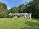 Well-maintained single-story home with a green lawn and mature landscaping at 7860 Henry Harris Rd, Fort Mill, SC 29707