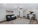 Spacious living room offering neutral paint, stylish rug and wood flooring at 7860 Henry Harris Rd, Fort Mill, SC 29707