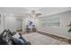 Cozy living room with ceiling fan, natural light, and comfortable seating at 7860 Henry Harris Rd, Fort Mill, SC 29707