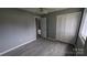 The bedroom features modern gray flooring and an adjacent closet at 824 S Laurel St, Lincolnton, NC 28092