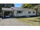 Charming single-story home with a carport and a well-maintained front yard at 824 S Laurel St, Lincolnton, NC 28092