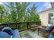 A back deck with outdoor seating and a view of the wooded backyard at 862 Kathy Dianne Dr, Fort Mill, SC 29707