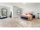 Spacious bedroom with plush carpet, bright natural light, and a comfortable bed with throw pillows at 862 Kathy Dianne Dr, Fort Mill, SC 29707