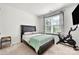 A bedroom with a bed, a window with blinds, and a stationary bike at 862 Kathy Dianne Dr, Fort Mill, SC 29707