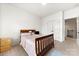 Bright bedroom featuring neutral walls, cozy carpet, and a comfortable wooden bed with decorative pillows at 862 Kathy Dianne Dr, Fort Mill, SC 29707