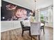 Elegant dining area featuring a floral wallpaper, dark wood floors, and a chandelier at 862 Kathy Dianne Dr, Fort Mill, SC 29707