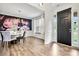 Stylish dining room features dark wood floors, a floral wallpaper, and natural light at 862 Kathy Dianne Dr, Fort Mill, SC 29707