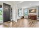 Bright entryway with dark wood floors, a piano, and a view of the front door at 862 Kathy Dianne Dr, Fort Mill, SC 29707
