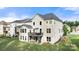 Back exterior view of home featuring wooden deck, patio, green grass, and gray roof at 862 Kathy Dianne Dr, Fort Mill, SC 29707
