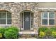 Arched stone doorway and dark door featuring a decorative wreath at 862 Kathy Dianne Dr, Fort Mill, SC 29707