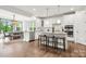Open kitchen featuring a large island with barstool seating and stainless steel appliances at 862 Kathy Dianne Dr, Fort Mill, SC 29707