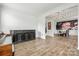 Formal living room features hardwood floors, wainscoting, and view into dining room with modern chandelier at 862 Kathy Dianne Dr, Fort Mill, SC 29707