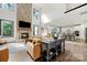 Open-concept living room with stone fireplace, soaring ceilings, and hardwood floors throughout at 862 Kathy Dianne Dr, Fort Mill, SC 29707