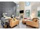 Bright living room with high ceilings, stone fireplace, and decorative accent wall at 862 Kathy Dianne Dr, Fort Mill, SC 29707