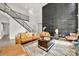 Spacious living room with unique feature wall and natural light from large windows and high ceilings at 862 Kathy Dianne Dr, Fort Mill, SC 29707