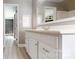 Bathroom featuring a white vanity, an oversized mirror, and plenty of light at 8905 Vagabond Rd, Mint Hill, NC 28227