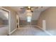Spacious bedroom with neutral tones, carpet and natural light, featuring a fan at 8905 Vagabond Rd, Mint Hill, NC 28227