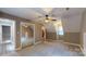 Spacious bedroom with neutral tones, carpet and natural light, featuring a fan at 8905 Vagabond Rd, Mint Hill, NC 28227