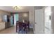 Cozy dining area features a modern light fixture and an adjacent doorway to the bathroom at 8905 Vagabond Rd, Mint Hill, NC 28227