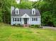 Charming home with light blue siding, dormer windows, and brick stairs leading to a covered front entry at 8905 Vagabond Rd, Mint Hill, NC 28227