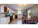 Updated kitchen with modern appliances, sleek countertops, wine rack, and a dining area for casual meals at 8905 Vagabond Rd, Mint Hill, NC 28227