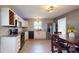 Eat-in kitchen with updated appliances, ample counter space, modern lighting, and a seamless flow to the dining area at 8905 Vagabond Rd, Mint Hill, NC 28227