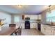 Well-lit kitchen features sleek, modern appliances and ample cabinet space at 8905 Vagabond Rd, Mint Hill, NC 28227