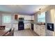 Well-lit kitchen features sleek, modern appliances and ample cabinet space at 8905 Vagabond Rd, Mint Hill, NC 28227