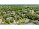 Aerial view of a neighborhood showing tree-lined streets and well-maintained homes at 9625 Donna Ve Ln, Charlotte, NC 28277