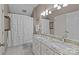 Traditional bathroom features a double vanity with granite countertops, tiled floors, and a shower with curtain at 9625 Donna Ve Ln, Charlotte, NC 28277