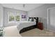 Bedroom with a window, fan, and built-in storage at 9625 Donna Ve Ln, Charlotte, NC 28277