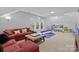 This expansive bonus room offers room to play, lounge, and watch TV at 9625 Donna Ve Ln, Charlotte, NC 28277