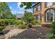 Brick two-story home with a stone walkway and manicured landscaping at 9625 Donna Ve Ln, Charlotte, NC 28277