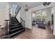 Grand foyer with staircase and hardwood floors and lots of natural light at 9625 Donna Ve Ln, Charlotte, NC 28277