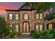 Elegant brick home featuring black trim, a double door entry, manicured shrubs, and a brick walkway at 9625 Donna Ve Ln, Charlotte, NC 28277