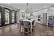 Modern kitchen with white cabinets, stainless steel appliances, and a large island at 9625 Donna Ve Ln, Charlotte, NC 28277