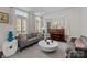 Bright living room with neutral tones, large windows, and comfortable seating at 9625 Donna Ve Ln, Charlotte, NC 28277