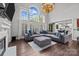 Inviting living room with grand windows, fireplace, and a spacious seating arrangement at 9625 Donna Ve Ln, Charlotte, NC 28277
