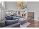 Open-concept living room offers a large sectional sofa and view into kitchen and dining room at 9625 Donna Ve Ln, Charlotte, NC 28277
