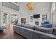 Spacious living room with a fireplace, high ceilings, and staircase access to the upper level at 9625 Donna Ve Ln, Charlotte, NC 28277