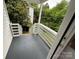 Charming back porch perfect for relaxing and enjoying the outdoor view at 103 Meadow Ne Ave # 6, Concord, NC 28025