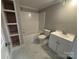 Well-lit bathroom featuring marble floors, built-in shelving, and a modern vanity with a sink at 103 Meadow Ne Ave # 6, Concord, NC 28025