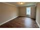Bedroom featuring hardwood floors and ample natural light at 103 Meadow Ne Ave # 6, Concord, NC 28025