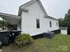 Exterior view of home with green lawn, AC Unit, and minimal landscaping at 103 Meadow Ne Ave # 6, Concord, NC 28025