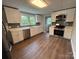 This is a spacious kitchen with white cabinets, modern appliances, and hardwood floors at 103 Meadow Ne Ave # 6, Concord, NC 28025
