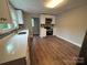 Open kitchen area with quartz countertops, stainless steel appliances, and gray tile backsplash at 103 Meadow Ne Ave # 6, Concord, NC 28025