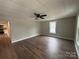 Open living room featuring hardwood floors, a ceiling fan, and natural light at 103 Meadow Ne Ave # 6, Concord, NC 28025