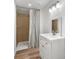 Updated bathroom features tile surround shower and modern vanity at 10379 Turnplow Dr, Davidson, NC 28036