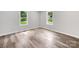 Bright bedroom with hardwood floors and natural light at 10379 Turnplow Dr, Davidson, NC 28036