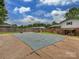 Fenced backyard with a pool covered for the winter at 1040 Spring Dr, Gastonia, NC 28052